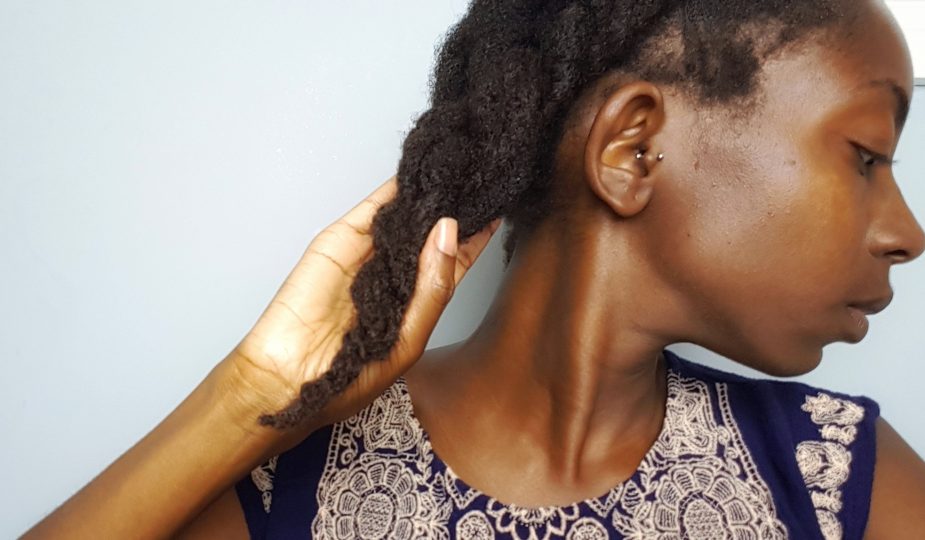 From A to 4z holding a thick braid of moisturized 4c hair