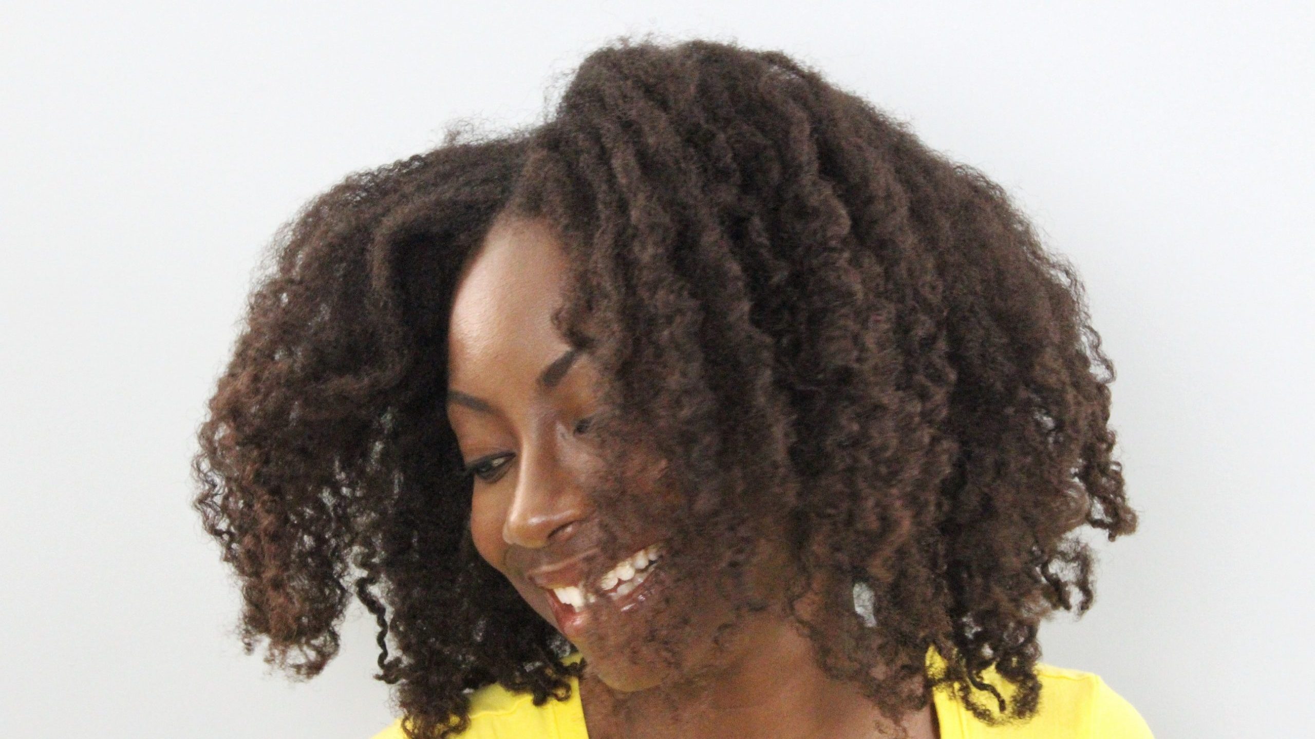 From A to 4z wearing a twist out to celebrate her natural hair journey